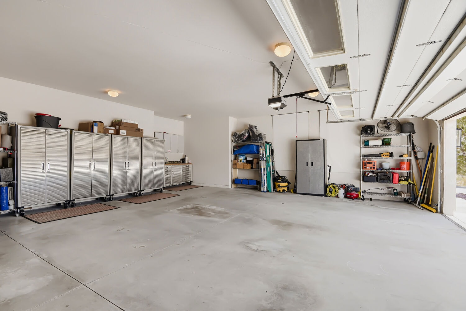 Organized garage interior with storage cabinets