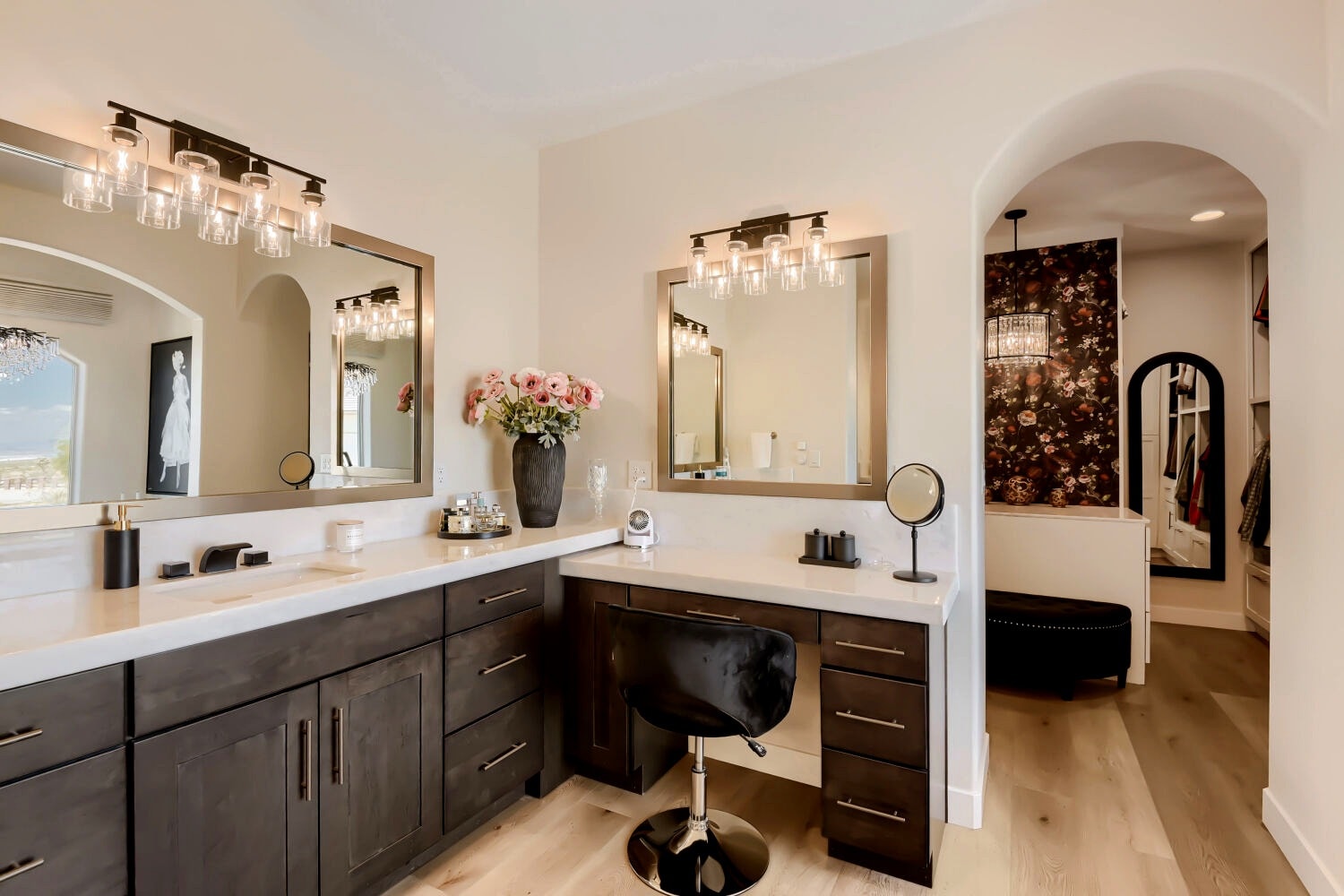 Dual vanity with custom cabinetry and mirror lighting