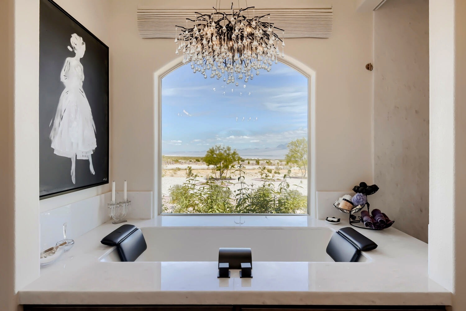 Primary bathroom with soaking tub and stone finishes