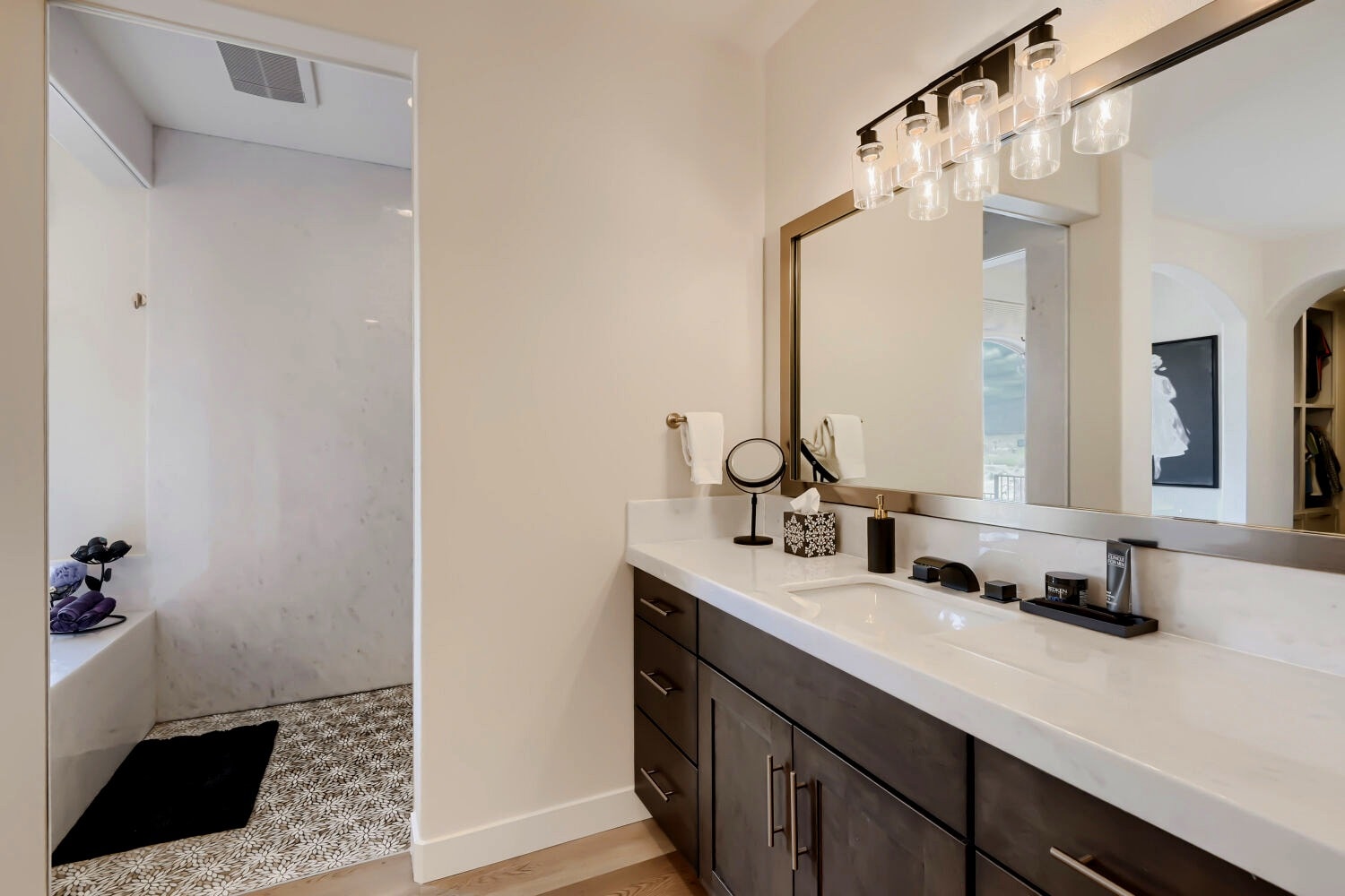 Bedroom with white closet storage